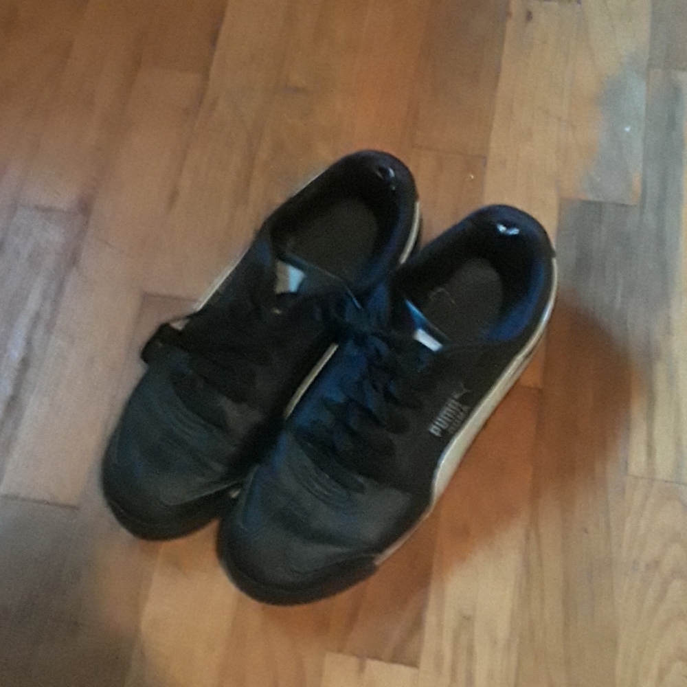 Black and white puma shoes